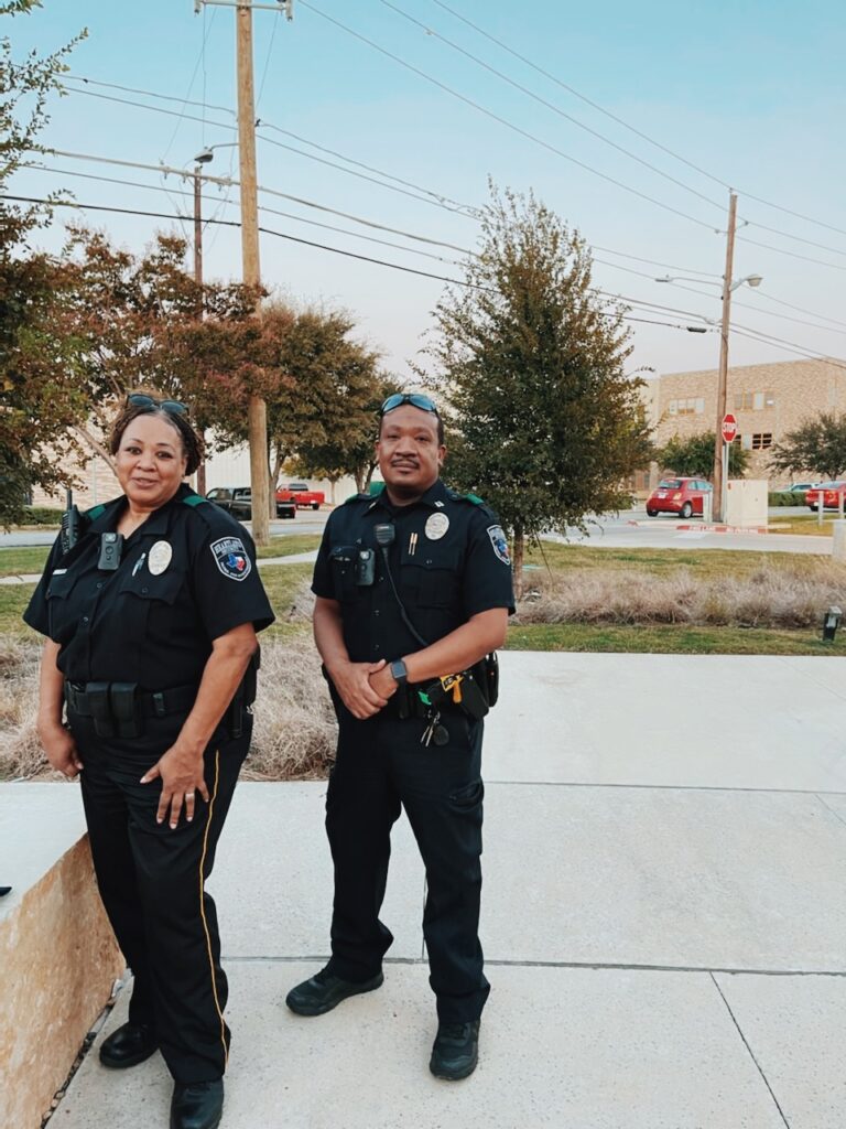 Man and woman wearing shades and a black patrol uniform